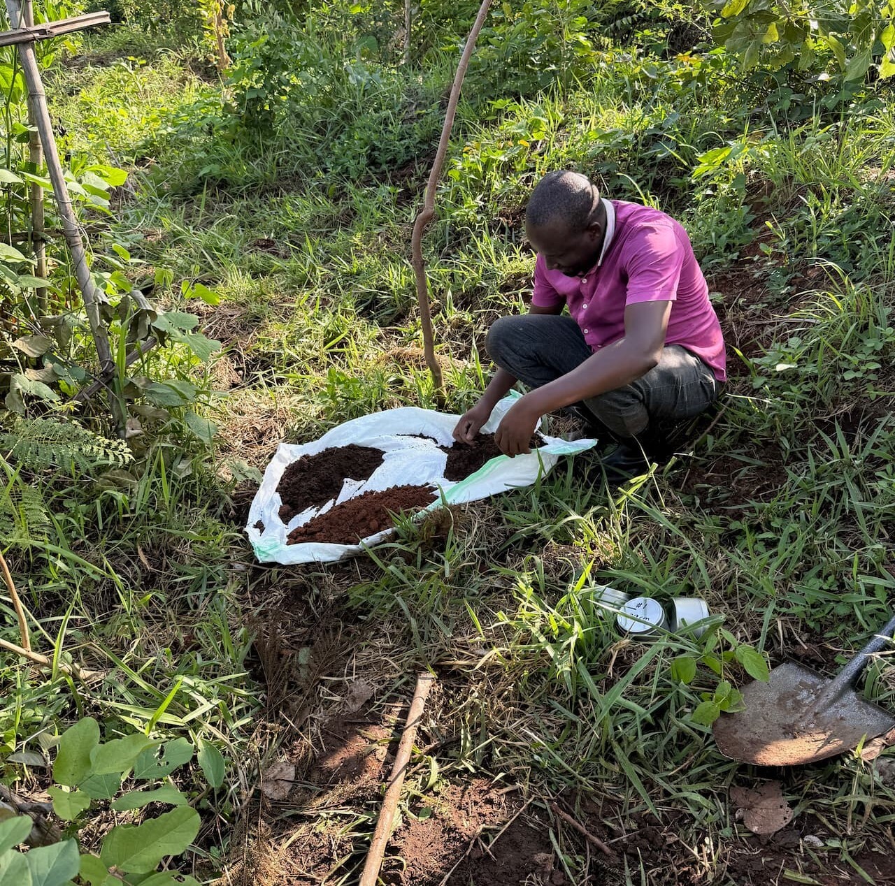 Man with 3 piles of soil of different colors