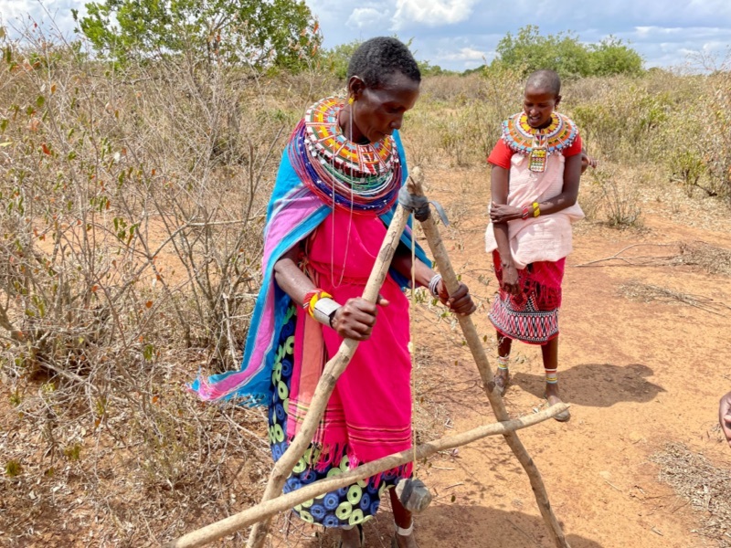 Two people working with an a-frame.